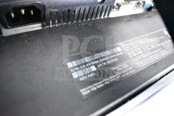 ```plaintext
Close-up of serial and model numbers on a device label, showing various technical specifications and manufacturing details.
```
