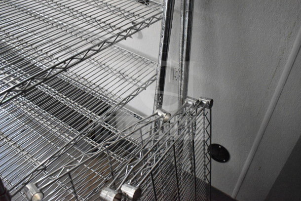 Interior view of 2021 Diamond Cargo 8.5'x24' food trailer, showing metal rack shelving, clean and well-maintained condition.