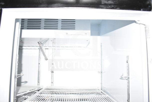 Interior view of 2021 Diamond Cargo 8.5'x24' cold food/beverage trailer in excellent condition, showing cooling unit details.