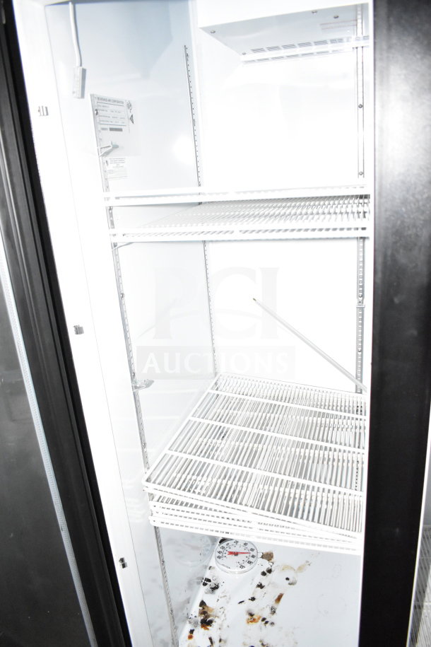 Interior of Diamond Cargo 8.5'x24' cold food/beverage trailer showing white wire shelving and a thermometer.