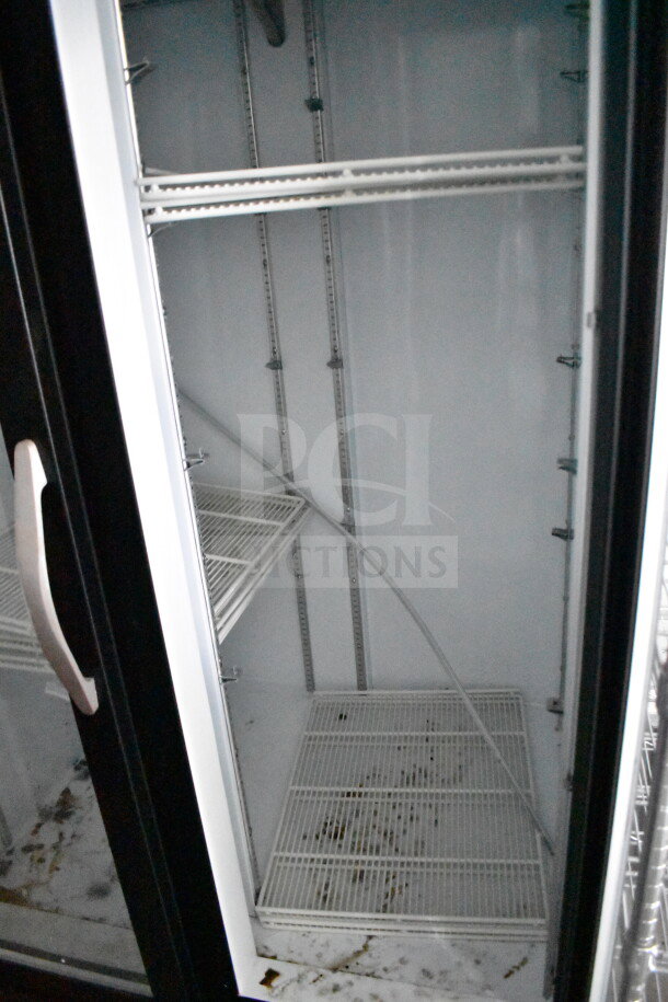 2021 Diamond Cargo 8.5'x24' cold food trailer interior, showing empty, clean shelving and lightly worn floor.