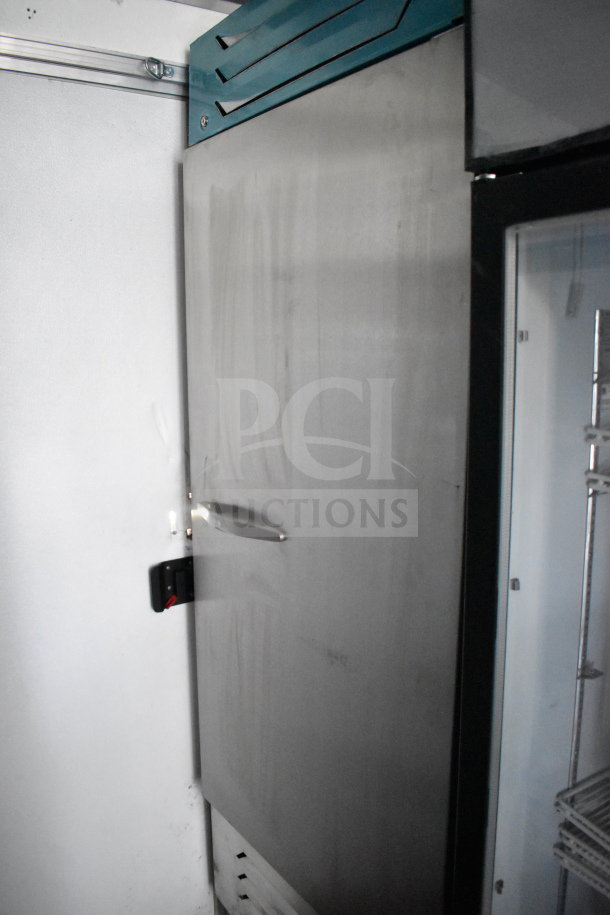 2021 Diamond Cargo 8.5'x24' cold food trailer, interior view. Stainless steel panel, cooling unit visible.