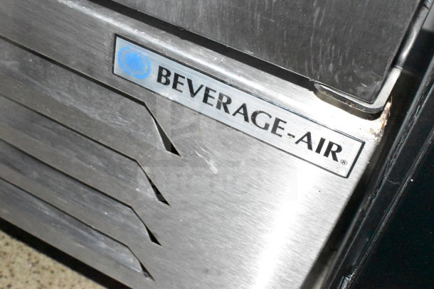 Close-up of Beverage-Air stainless steel trim on a 2021 Diamond Cargo cold food/beverage trailer, minor wear visible.