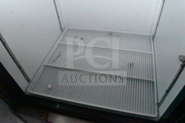 2021 Diamond Cargo 8.5'x24' Cold Food Trailer interior; metal shelving; visible stains; model VIN: 53NBE2424M1089867.