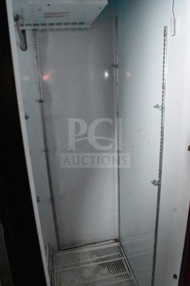 Interior of a 2021 Diamond Cargo 8.5'x24' cold food/beverage trailer, showing shelving and cooling unit setup.