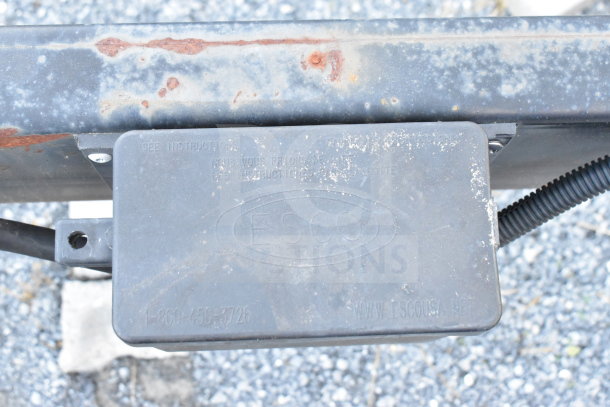 Rusty hitch of 2021 Diamond Cargo 8.5'x24' trailer, with ESCO label and contact details, showing wear.