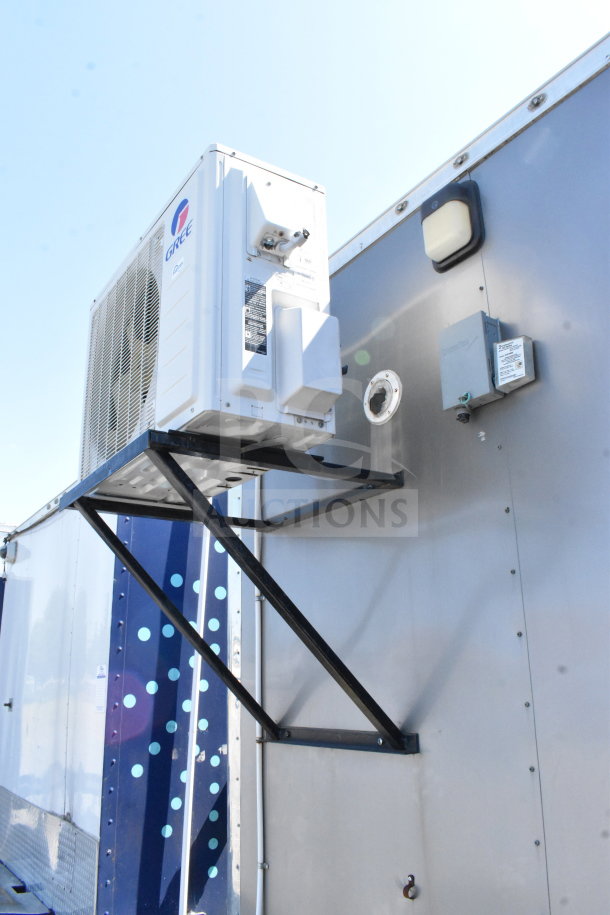 2021 Diamond Cargo 8.5'x24' cold food/beverage trailer exterior with Gree AC unit, metal frame, and utility connections.