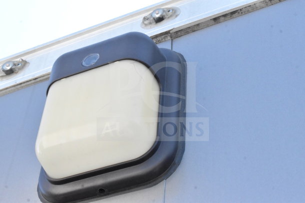 Close-up of external light fixture on 2021 Diamond Cargo 8.5'x24' cold food/beverage trailer, showcasing condition.