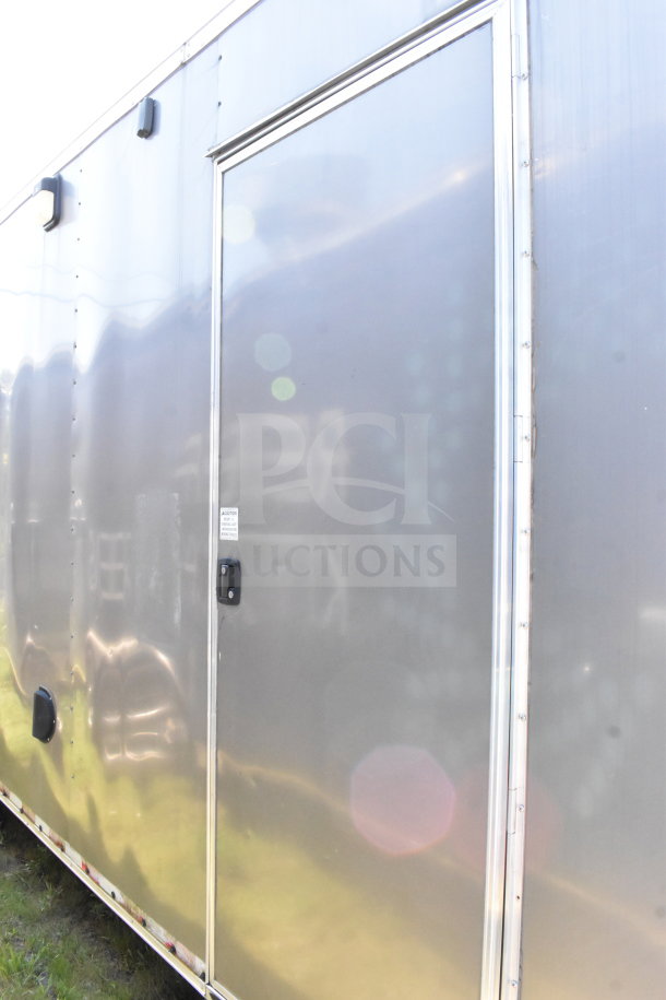 2021 Diamond Cargo 8.5'x24' cold food trailer, silver exterior, side door with handle, VIN: 53NBE2424M1089867.