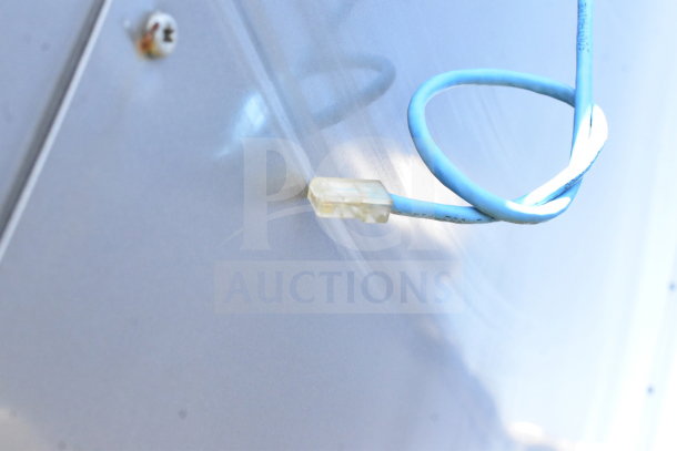 Close-up of blue electrical wire on 2021 Diamond Cargo 8.5'x24' trailer. Markings on wire indicate specifications.