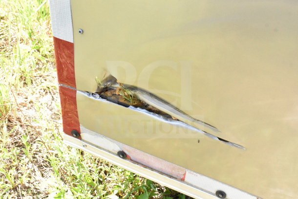 2021 Diamond Cargo 8.5'x24' trailer with noticeable side damage; tear exposing insulation. VIN: 53NBE2424M1089867.