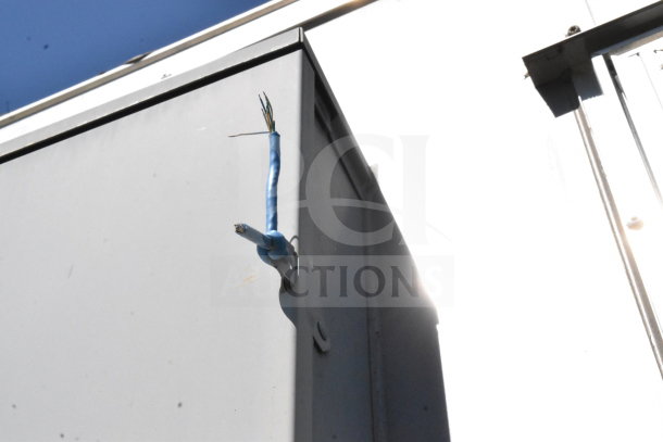 2021 Diamond Cargo 8.5'x24' cold food/beverage trailer with visible electrical wiring issue on the exterior. VIN: 53NBE2424M1089867.