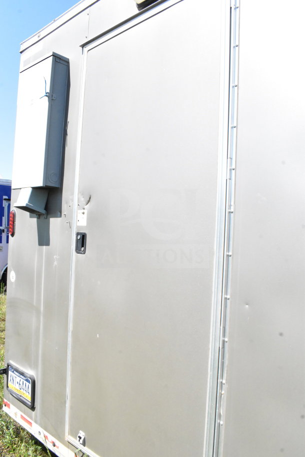 2021 Diamond Cargo 8.5'x24' cold food trailer with visible exterior damage, steel construction, and side door.