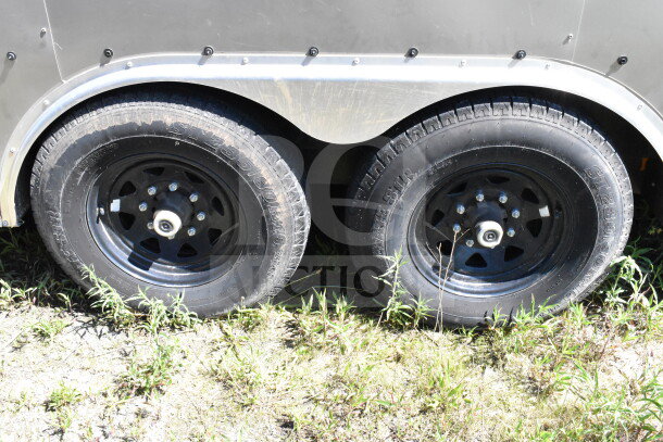 2021 Diamond Cargo trailer, 8.5'x24', dual axle, black wheels, visible tire tread. Suitable for cold food/beverage transport.