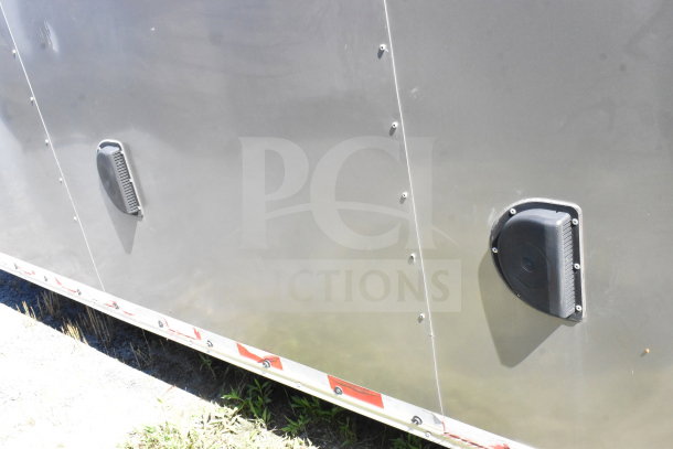 2021 Diamond Cargo 8.5'x24' food trailer, gray exterior with ventilation features, clean condition.