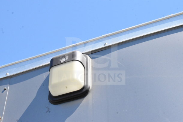 2021 Diamond Cargo 8.5'x24' trailer exterior light detail, VIN: 53NBE2424M1089867, clean condition.