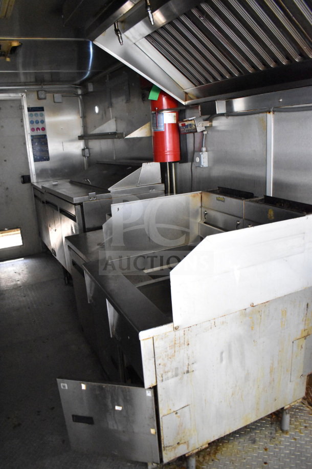 2019 Diamond Cargo 8.5'x24' food trailer with grease hood, suppression system, refrigeration, and fryer. Visible wear.