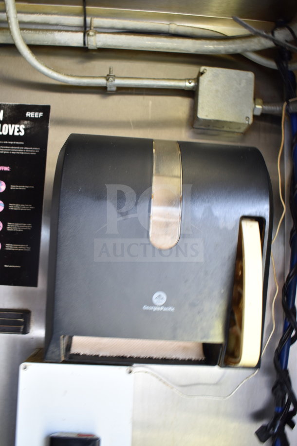 Paper towel dispenser inside 2019 Diamond Cargo 8.5'x24' food trailer, equipped with grease hood, suppression system, refrigeration, fryer.