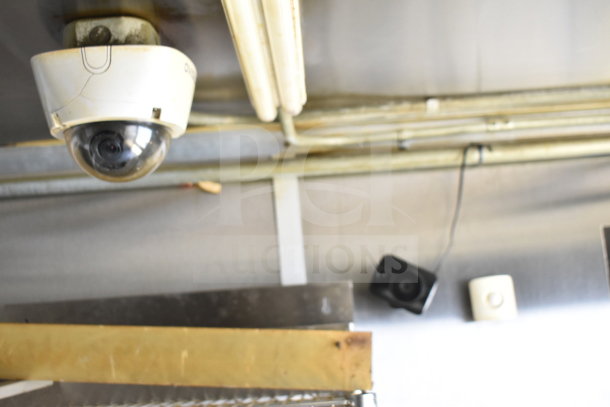 Interior view of 2019 Diamond Cargo 8.5'x24' food trailer. Ceiling features visible, including security cameras and wiring.