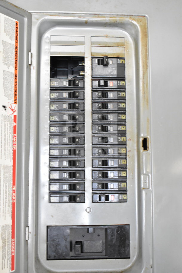 Electrical panel with multiple circuit breakers inside a 2019 Diamond Cargo 8.5'x24' food trailer.