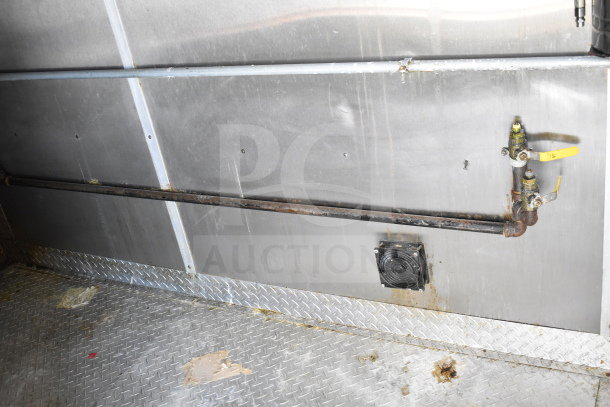 2019 Diamond Cargo 8.5'x24' food trailer with interior view showing steel wall, floor, and ventilation. Some rust visible.