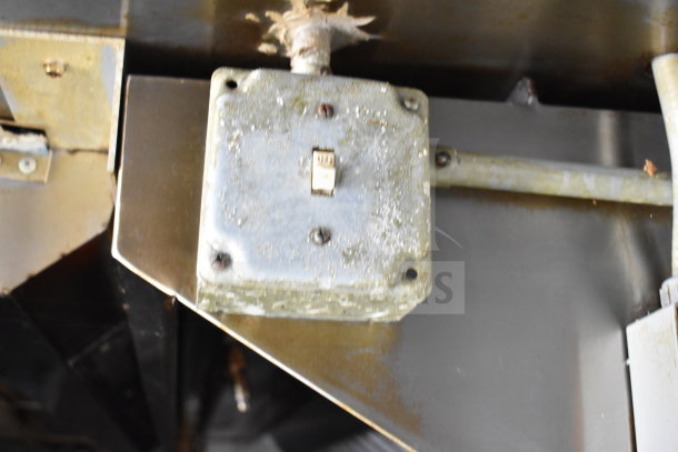 Electrical control switch in a 2019 Diamond Cargo 8.5'x24' food trailer, showing wear and surface rust.
