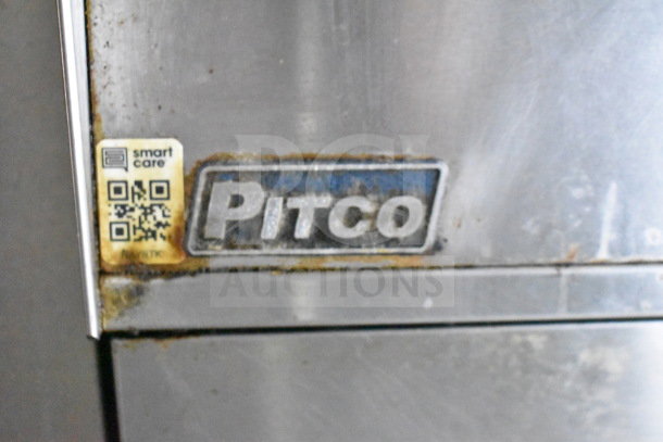 Close-up of a Pitco fryer panel with a "smart care" QR code label, showing slight rust and wear.