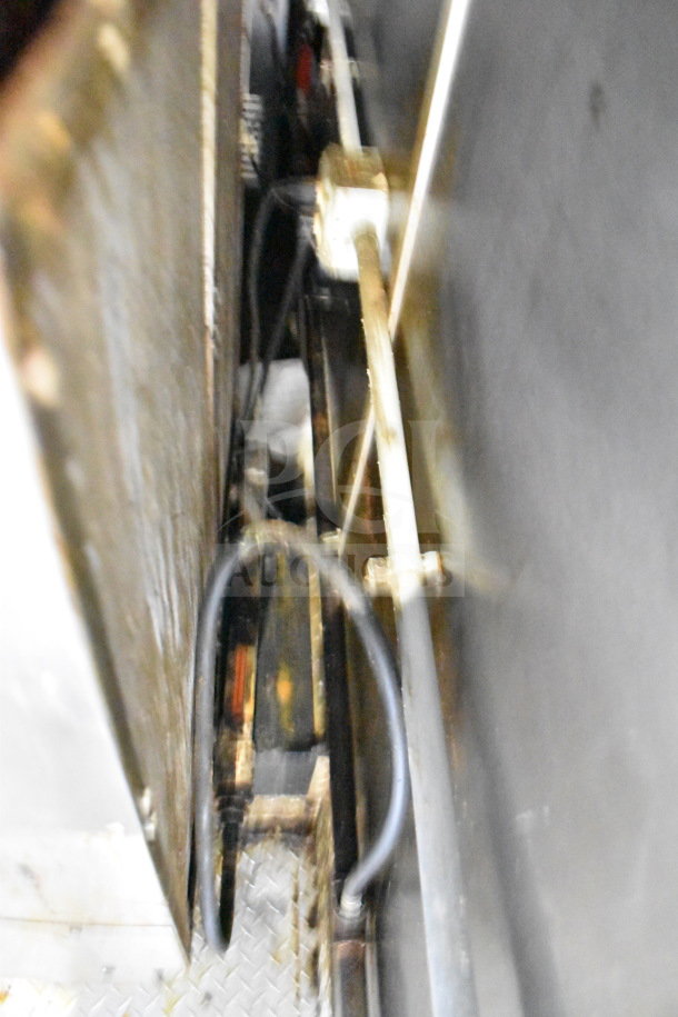 Interior view of 2019 Diamond Cargo 8.5'x24' food trailer, showing plumbing and electrical wiring, used condition.