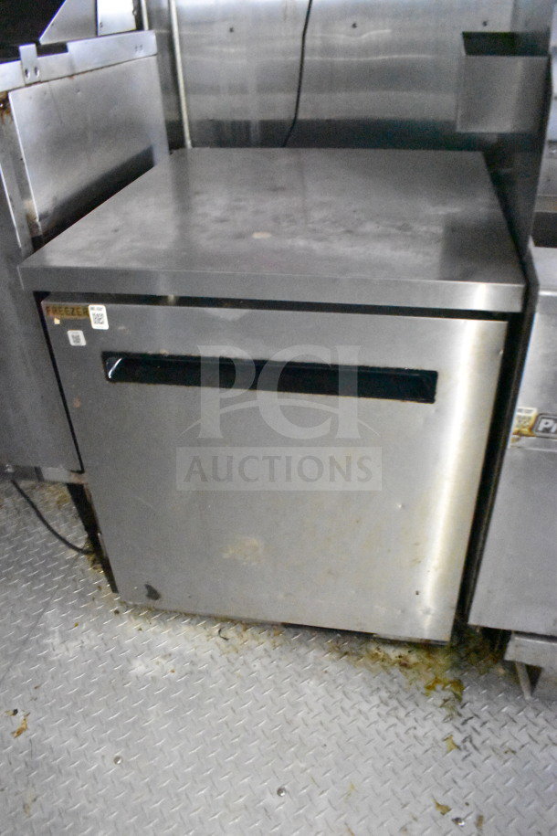 2019 Diamond Cargo food trailer kitchen interior, showing stainless steel refrigeration unit with visible wear.