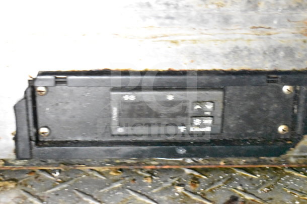 Control panel of a Diamond Cargo food trailer, showing settings and adjustments for refrigeration systems.