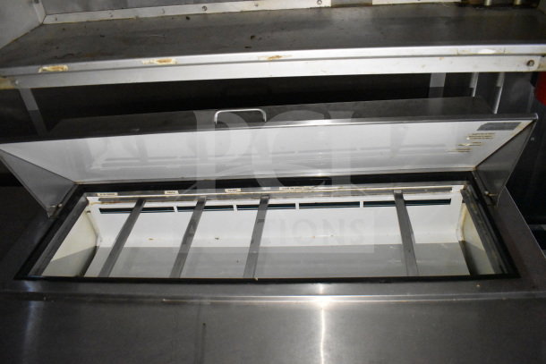 2019 Diamond Cargo 8.5'x24' food trailer interior, showcasing refrigeration unit with labeled compartments for ingredients.
