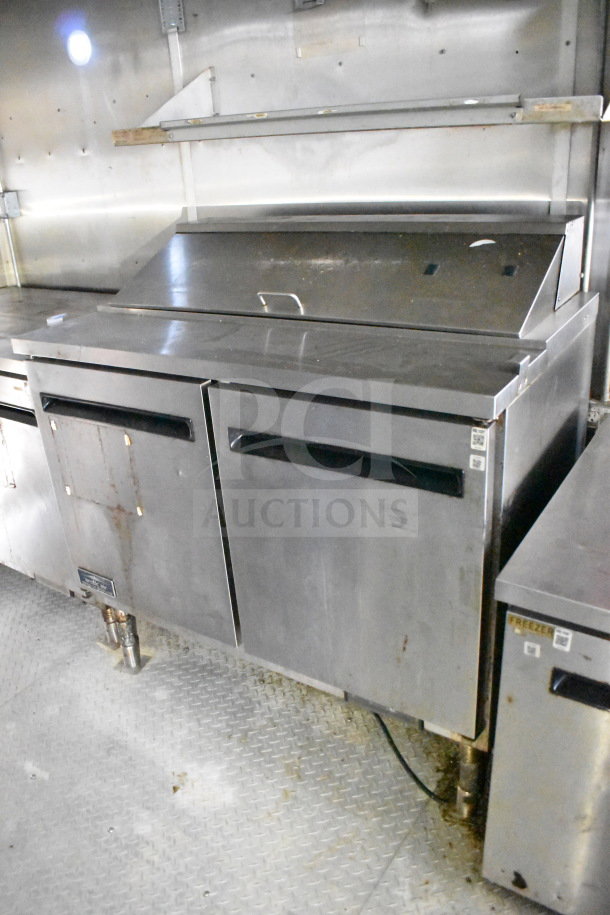 2019 Diamond Cargo 8.5'x24' food trailer interior, featuring a grease hood, refrigeration, and fryer. Stainless surfaces visible.
