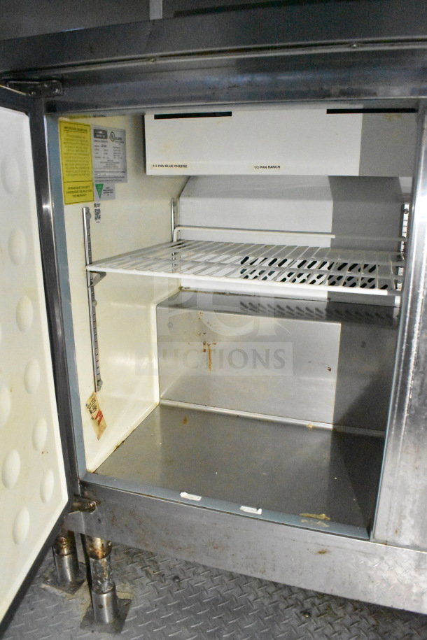 2019 Diamond Cargo food trailer interior shelving, showing grease hood and ventilation system. Slight wear visible.