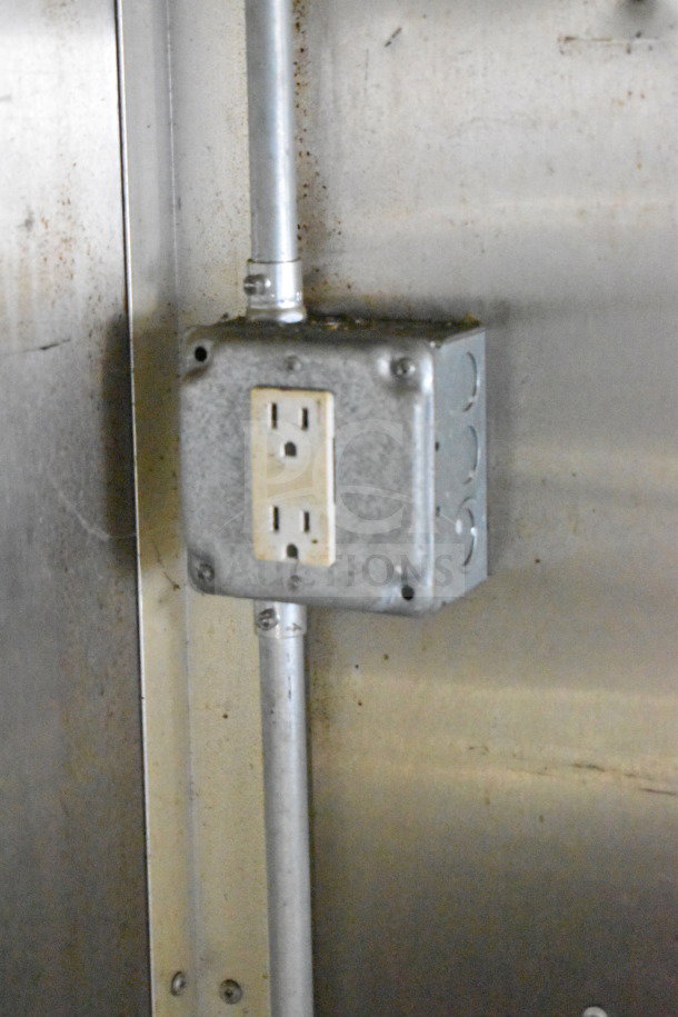 2019 Diamond Cargo food trailer interior with electrical outlet on metal wall. Visible wiring in used condition.