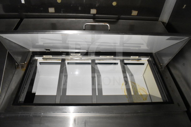 2019 Diamond Cargo 8.5'x24' food trailer interior with open refrigeration compartment; labeled slots include spring mix and romaine.