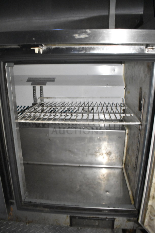 2019 Diamond Cargo food trailer interior, features shelving and refrigeration unit. Visible wear inside. VIN: 53NBE2426L1076066.