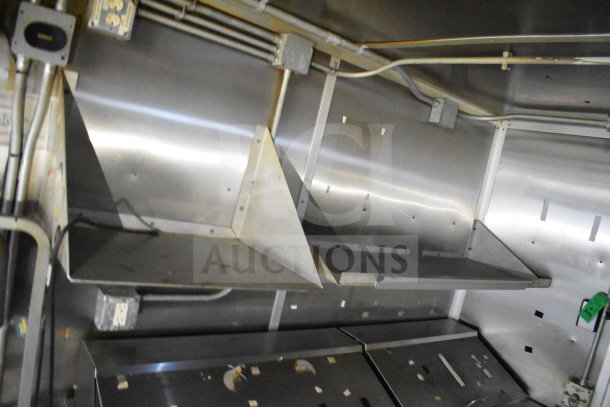 2019 Diamond Cargo 8.5'x24' food trailer interior view, featuring stainless steel grease hood and suppression system in good condition.