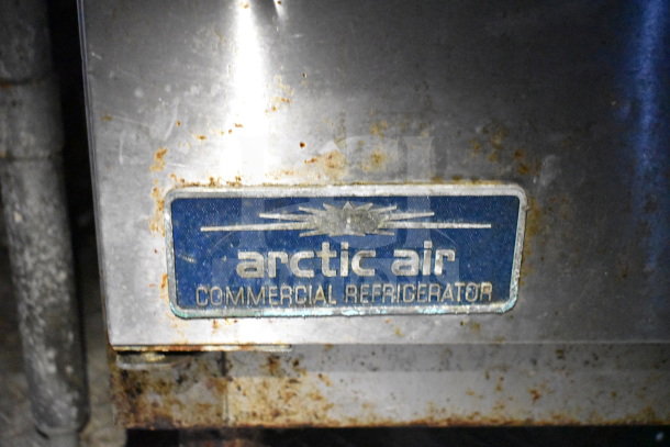 Arctic Air commercial refrigerator label on a used 2019 Diamond Cargo food trailer, showing signs of rust.