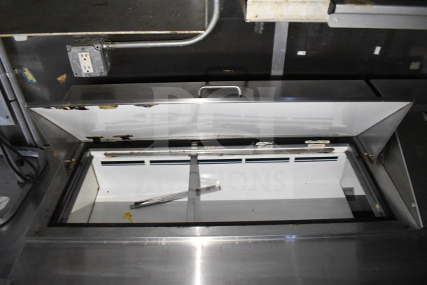 2019 Diamond Cargo 8.5'x24' food trailer interior showing refrigeration unit and stainless steel fixtures.