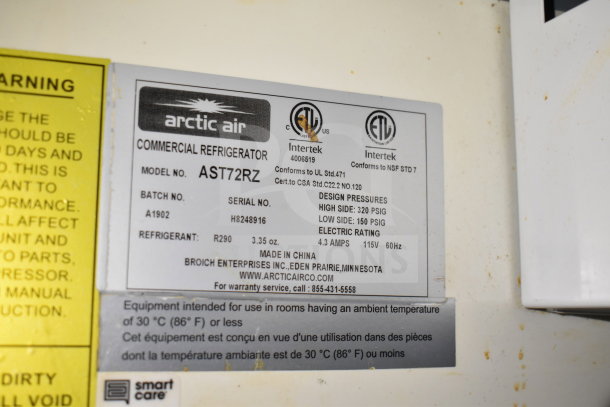 Label of Arctic Air Commercial Refrigerator, Model AST72RZ, showing design pressures and electric rating.