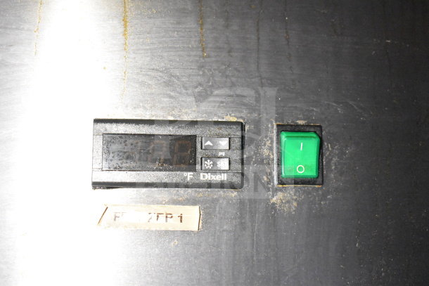Digital control panel on 2019 Diamond Cargo food trailer with temperature display and green power switch. Dixell label visible.