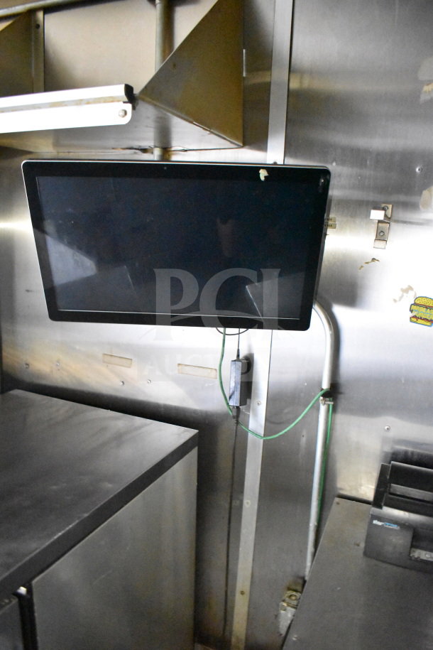 2019 Diamond Cargo 8.5'x24' food trailer interior with grease hood, refrigeration, and fryer. Features stainless steel surfaces.