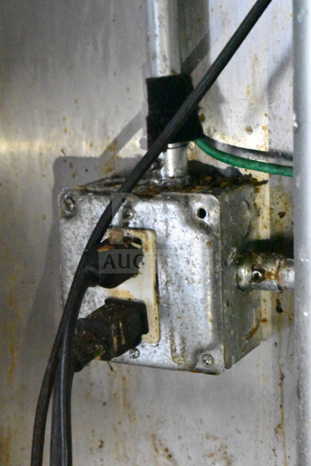 Close-up of an electrical outlet inside a 2019 Diamond Cargo food trailer, showing wear and usage.