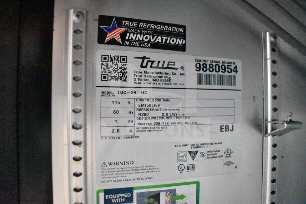 Label inside Diamond Cargo food trailer, showing True refrigeration specs. Model TUC-24-HC, serial 9880954, using refrigerant R290.
