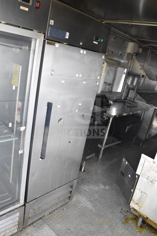 2019 Diamond Cargo 8.5'x24' food trailer interior, featuring refrigeration, grease hood, suppression system, and fryer. Used condition.