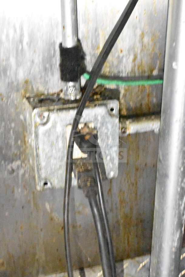 Close-up of electrical wiring in a 2019 Diamond Cargo food trailer, showing rust and wear on metal surfaces.