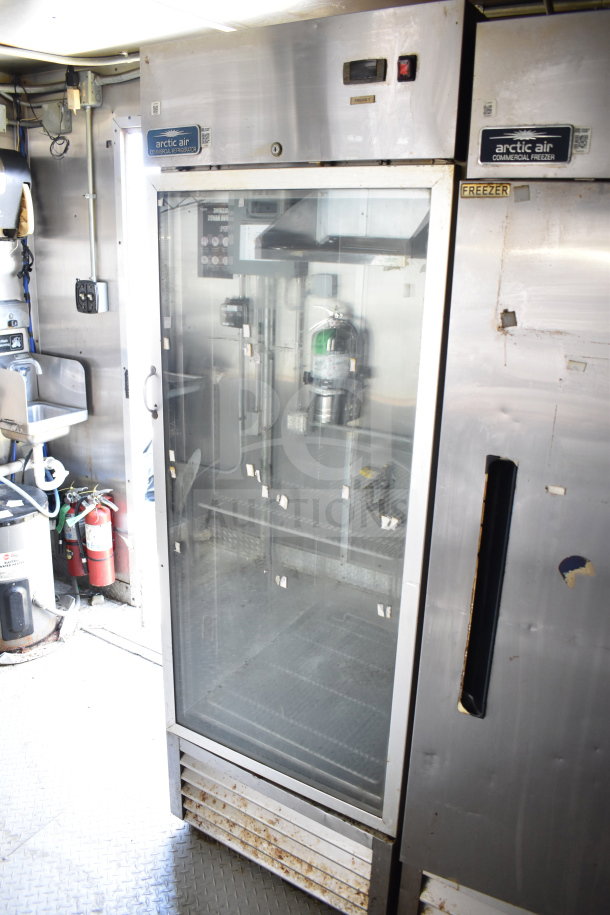 2019 Diamond Cargo 8.5'x24' food trailer interior with Arctic Air refrigeration, visible grease hood, suppression system, and fryer.