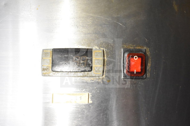 Control panel of the 2019 Diamond Cargo food trailer, featuring a digital display and a red switch.