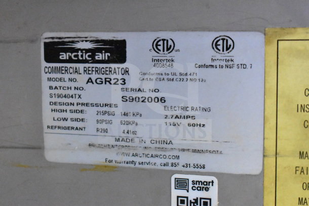 Label on Arctic Air Commercial Refrigerator, model AGR23, serial S902006, showing design pressures and electric rating.