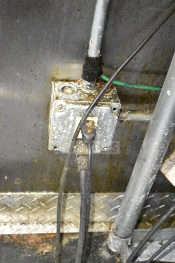 Electrical installation inside a 2019 Diamond Cargo food trailer, showing a weathered outlet and wiring.